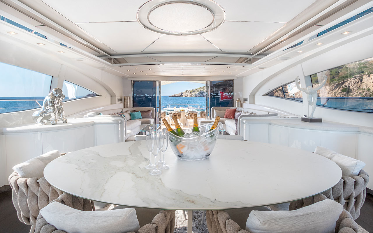 Yacht Charter Ibiza Mangusta 108 main deck dining