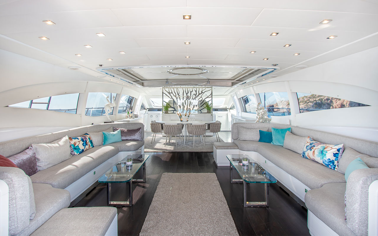 Yacht Charter Ibiza Mangusta 108 main deck lounge