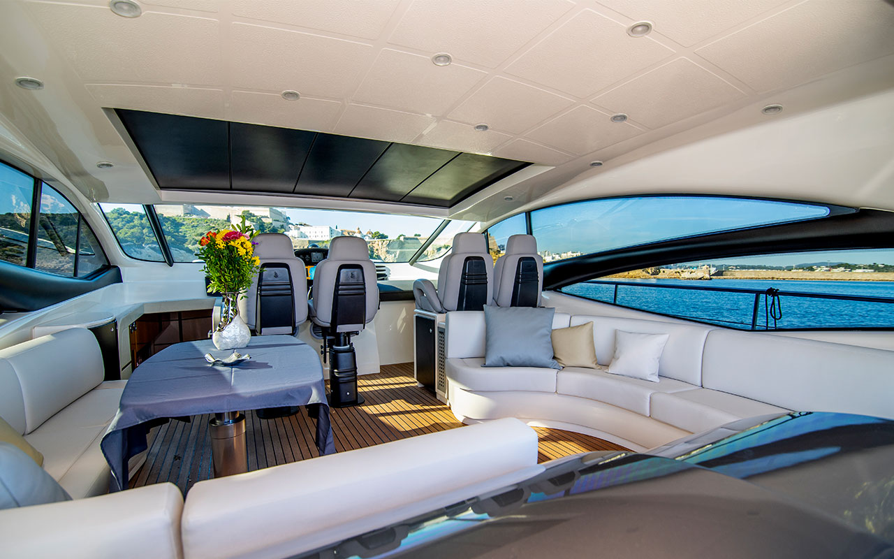 Yacht Charter Ibiza Pershing 62 main deck lounge